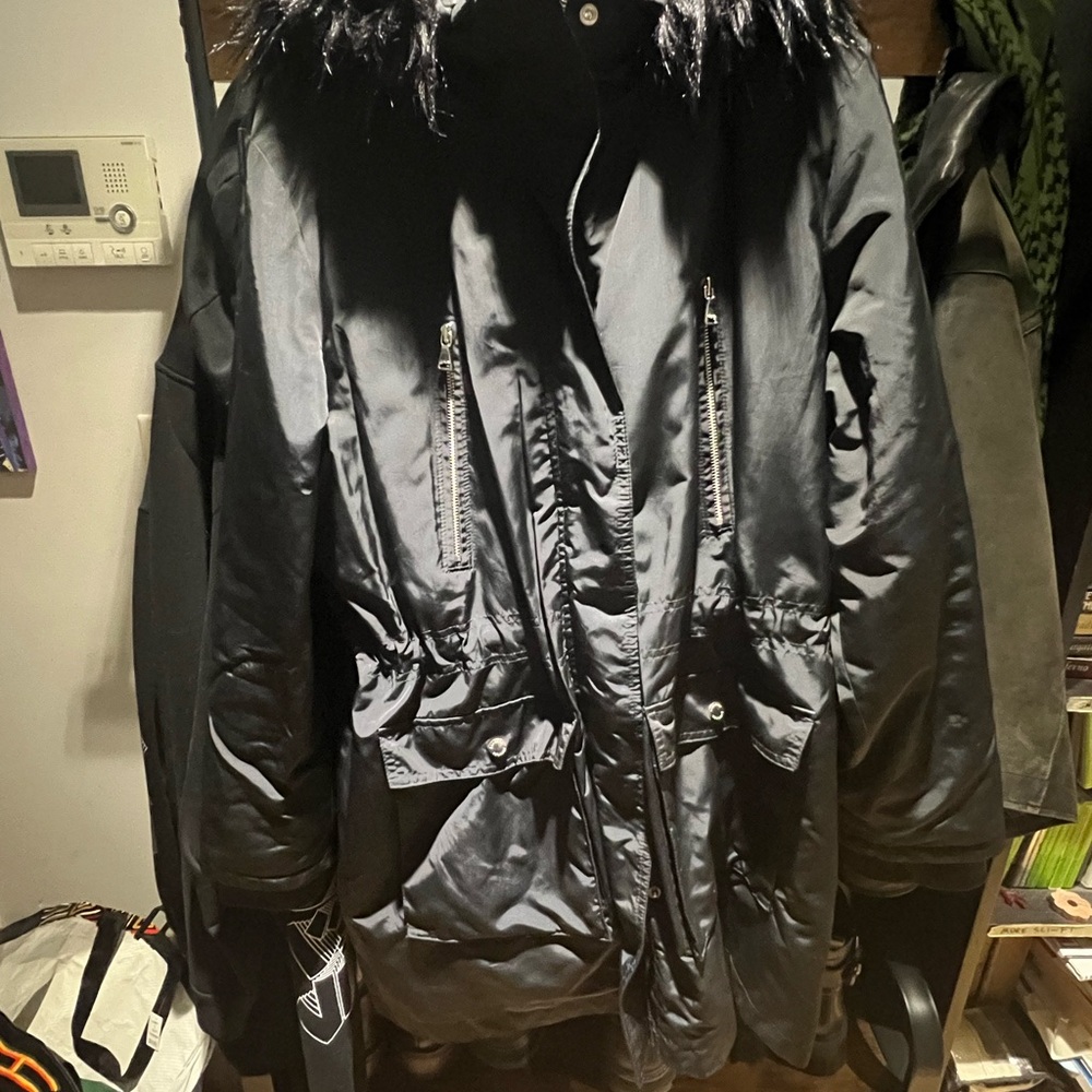 Express Black Snow Jacket with Faux Fur Trim and white leopard print inner line.